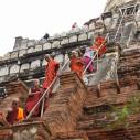 Monks climbing down Shwesandaw pagoda
